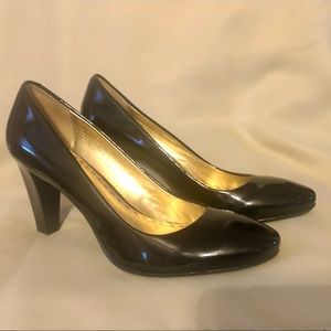Coach black patent leather pumps.